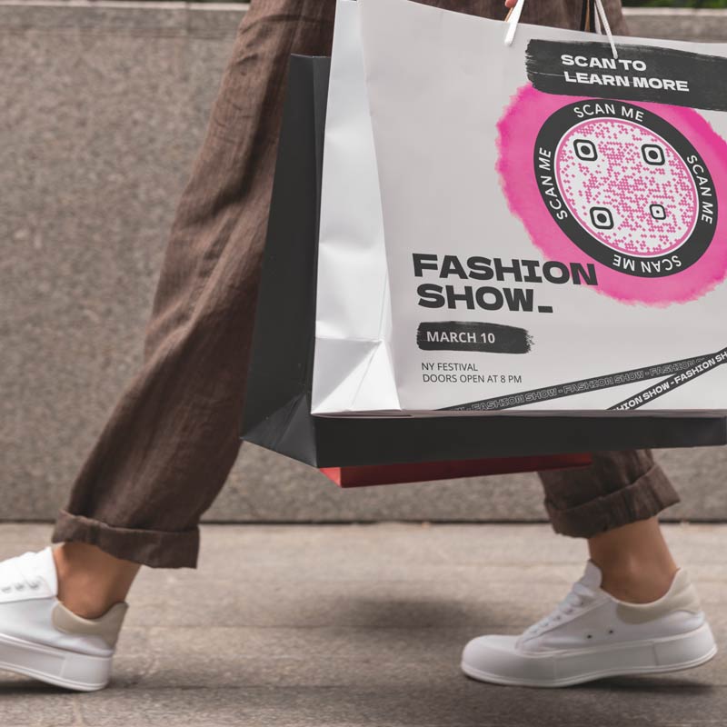 QR code for business page placed on a shopping bag of a fashion retailer