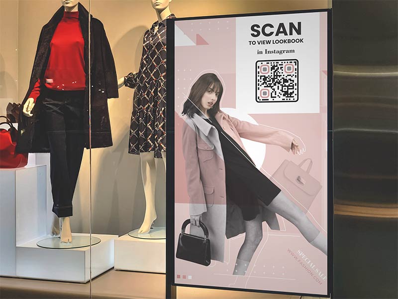 IG QR code displayed on a banner in a fashion store