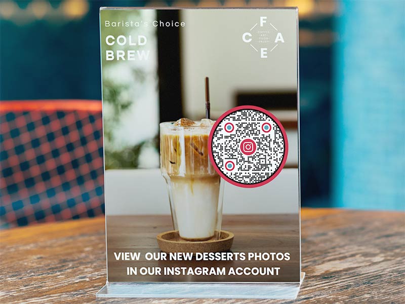 Instagram QR code on a table at a cafe showing additional coffee options that can be viewed on Instagram